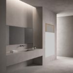 Bagno dove è installato un sistema di riscaldamento radiante elettrico completamente invisibile perché inseritc direttamente in porzioni di parete